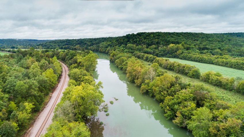 Aerial flight over the Spring River next to the BNSF railroad in Hardy, Arkansas - Image.