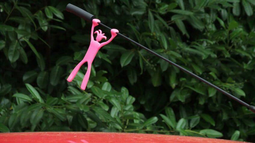 Car Aerial Topper, figure holding on by its hands - Image.