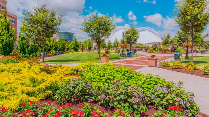 brick path in park, Five Rivers Metropark, Metropark, flower planters in park.