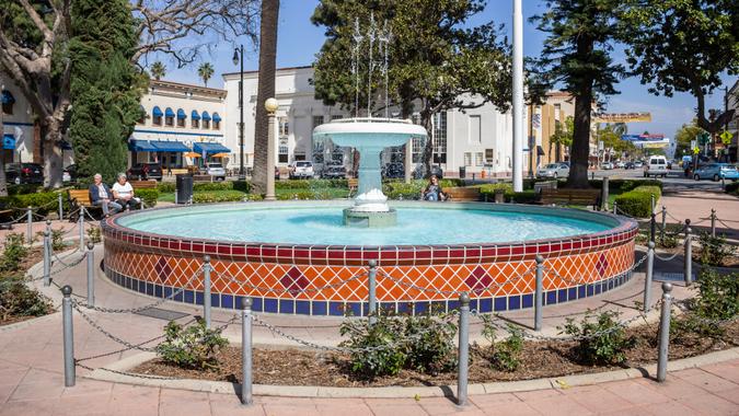 Old Towne Orange, California shutterstock_1352796314 Orange, California/United States - 03/24/19: The fountain in the center of the traffic circle at Orange Plaza - Image.