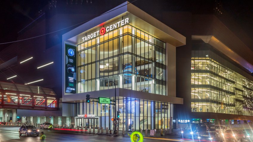 MINNEAPOLIS, MN - JANUARY 2019 - A Wide Angle Shot Traffic in front of the Target Center before a Timberwolves Game during a Winter Night - Image.