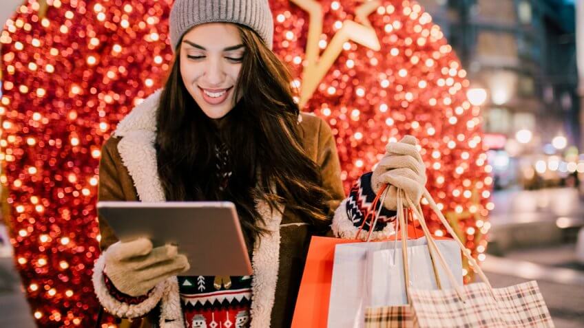 Young woman looking at digital tablet.