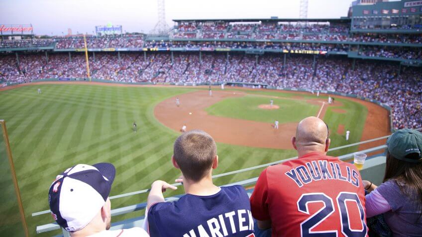 baseball fans watch from upper deck at Fenway Park