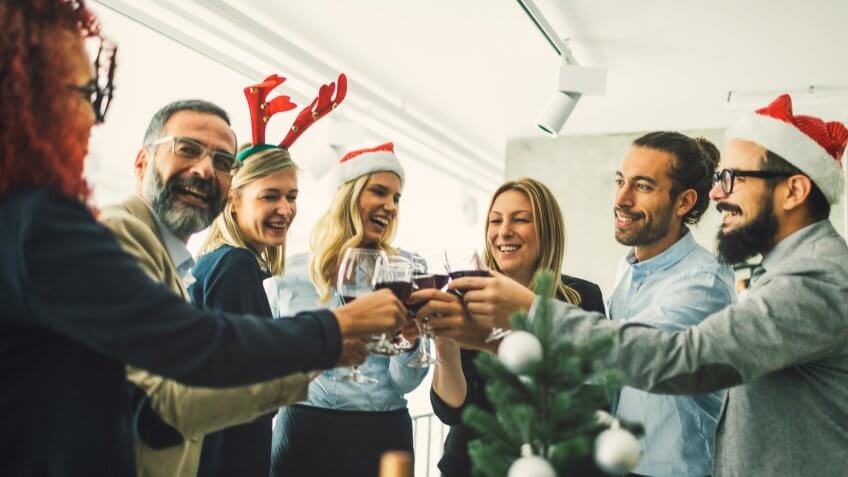 Business people celebrating Christmas At Workplace.