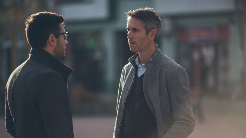 Two business people walking.