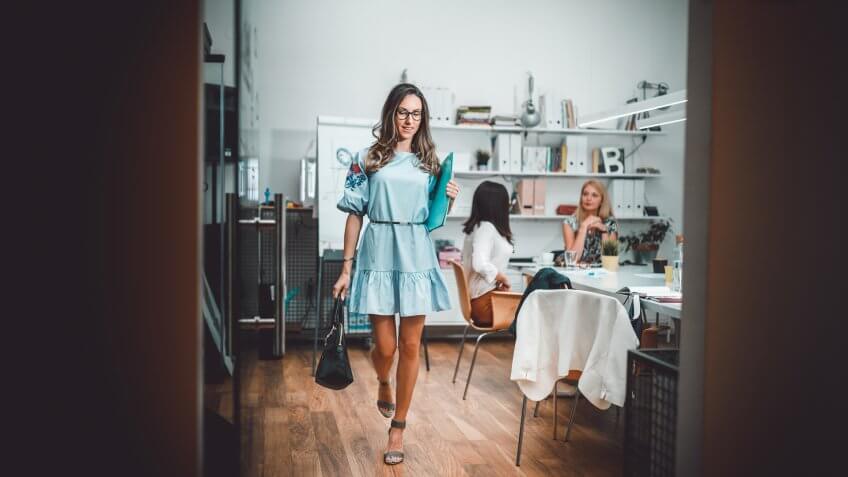 Businesswoman going from the office meeting.