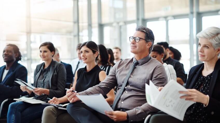 Shot of a group of businesspeople attending a conference.
