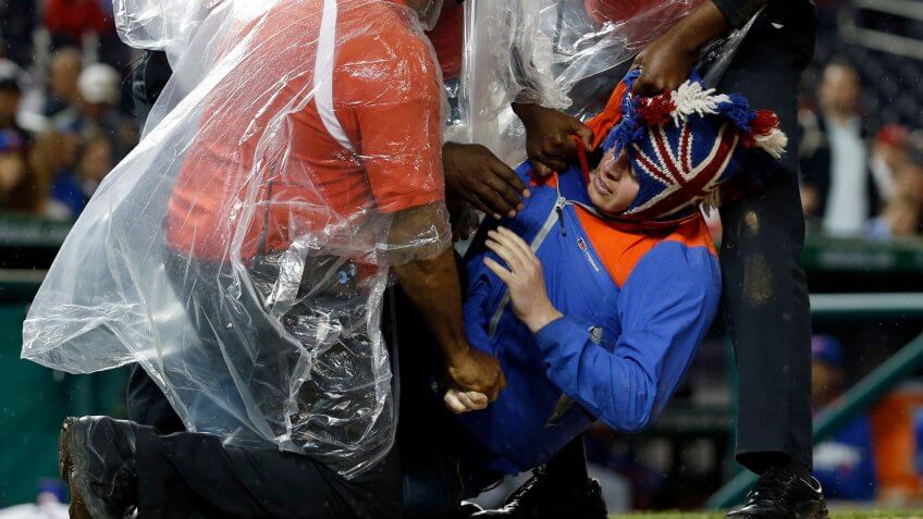 fan runs on field during baseball game