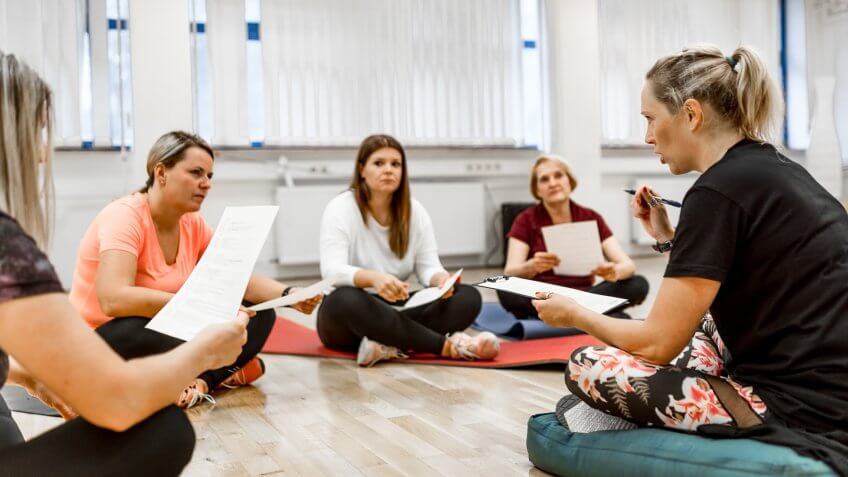 Caucasian women, different ages, talking about healthy life at the gym.