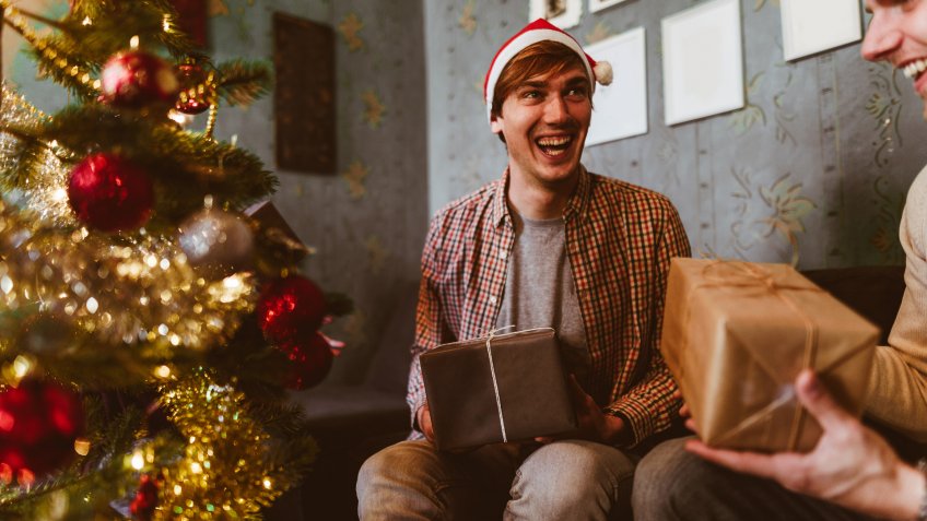 exchanging the Christmas presents at home.