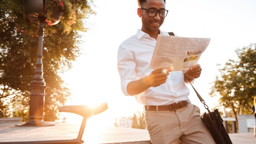 guy reading newspaper