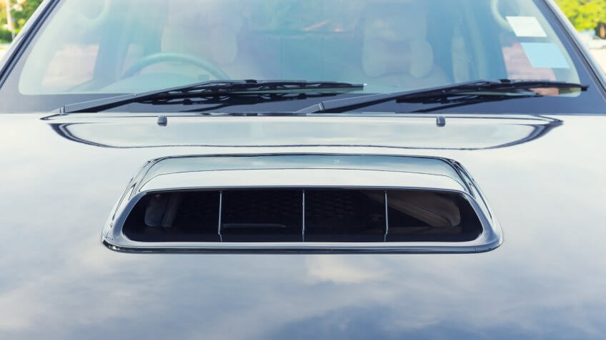 Bonnet or hood of car, black color and shiny.