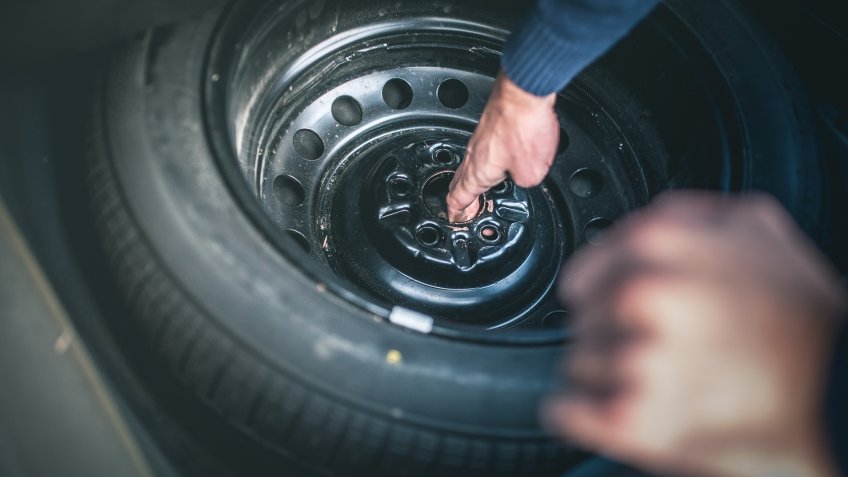 Man changing a tire.