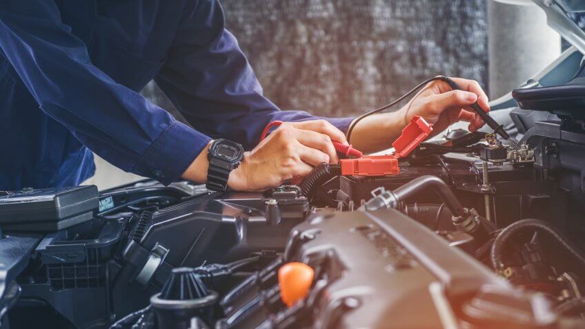 mechanic testing battery charge