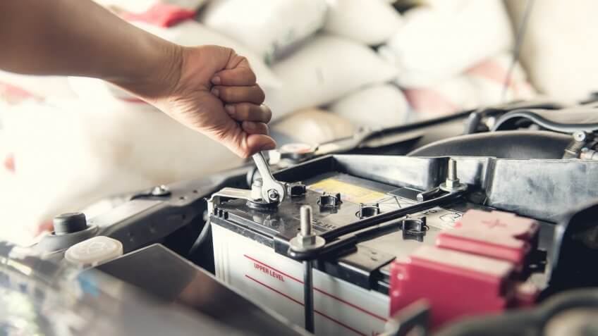 mechanic tightening battery connection