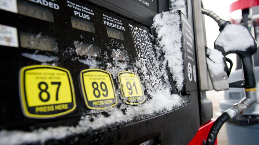 snow frozen gas pump