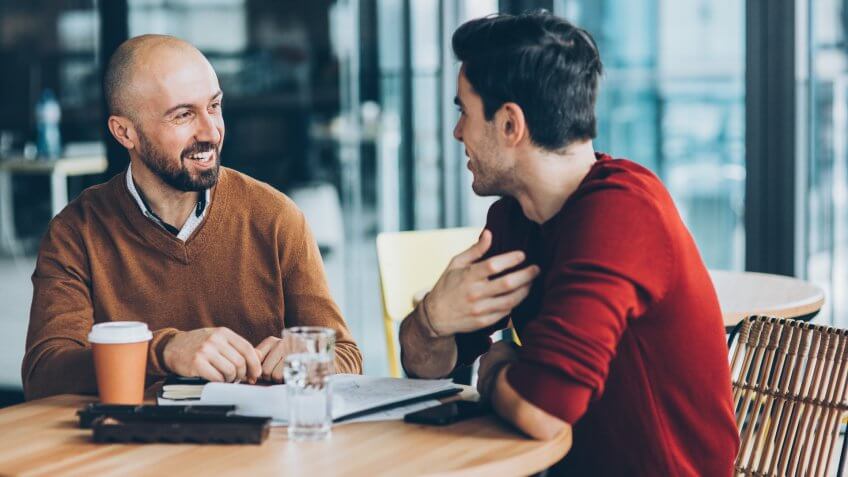 Business persons in informal discussion.