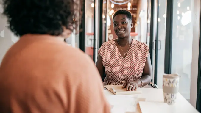 Women offering new mortgage rates to the client.