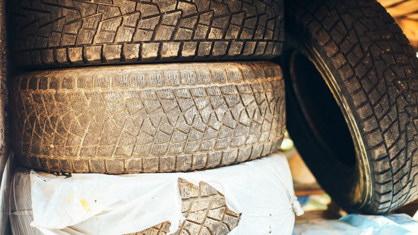 A pile of old, worn tires.