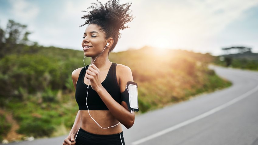Shot of a sporty young woman running outdoors.