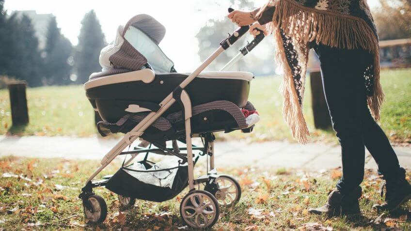 Young mother with a baby stroller.