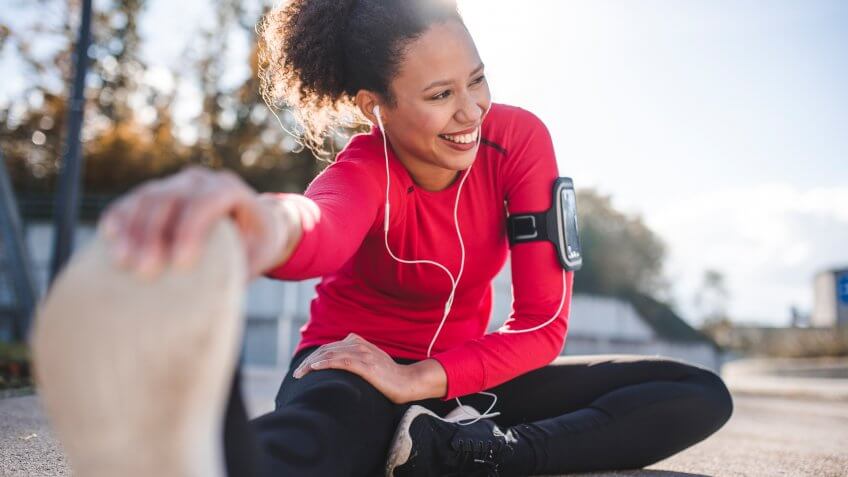 Woman stretching ham strings before a run.
