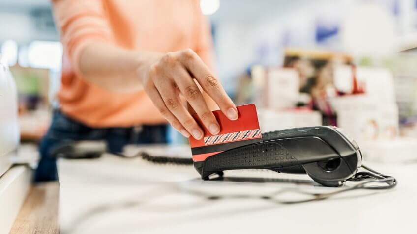 Customer paying with contact less card.