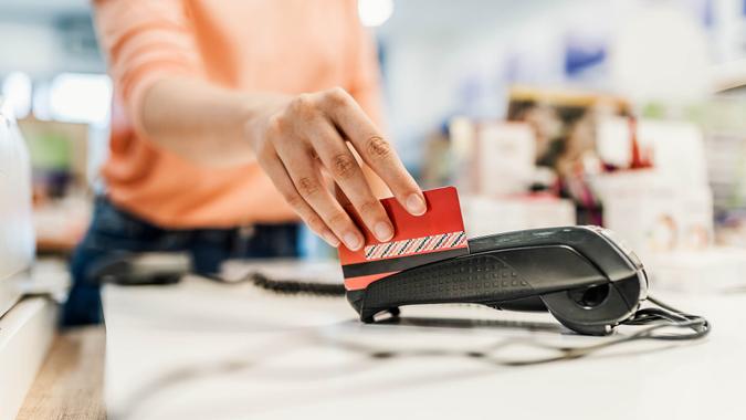 Customer paying with contact less card.