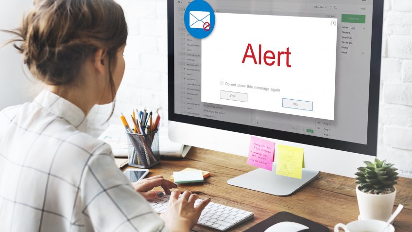 woman with email alert on computer