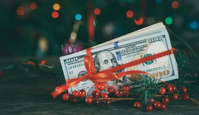 American 100 US dolllars as a Christmas gif t or a Christmas spending concept.