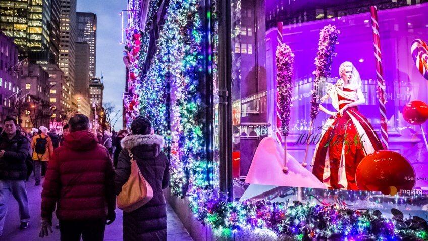 NEW YORK-DECEMBER 7: Tourists and New Yorkers admire the holiday decorations and lights on Saks Fifth Avenue on December 7 2016 in New York City.