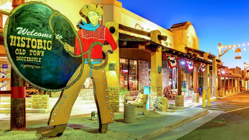 Scottsdale, Arizona, USA - March 9, 2019: The City owned iconic Old Town Scottsdale cowboy welcome sign located in the Old Town district.