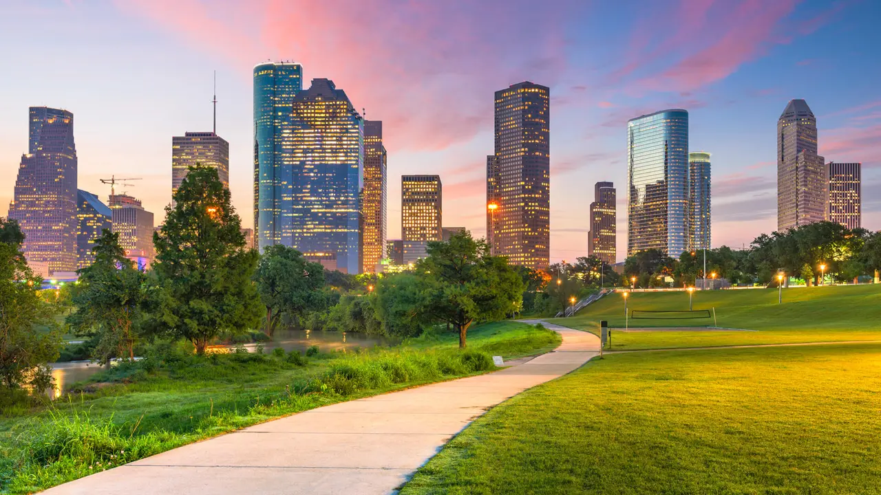 Houston, Texas, USA downtown city skyline and park at dawn.