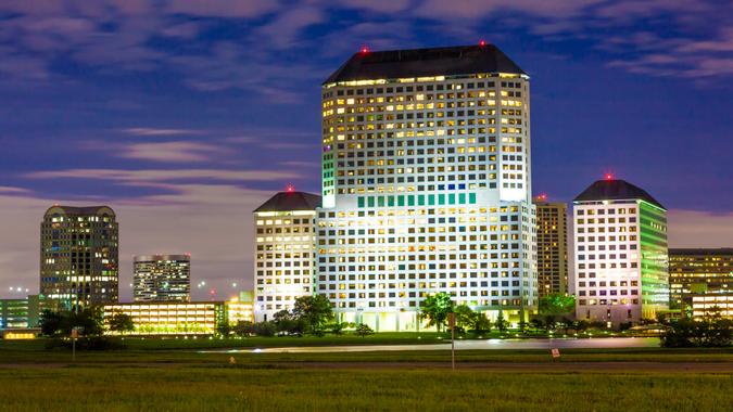 Buildings in Las Colinas, Irving illuminated at night.