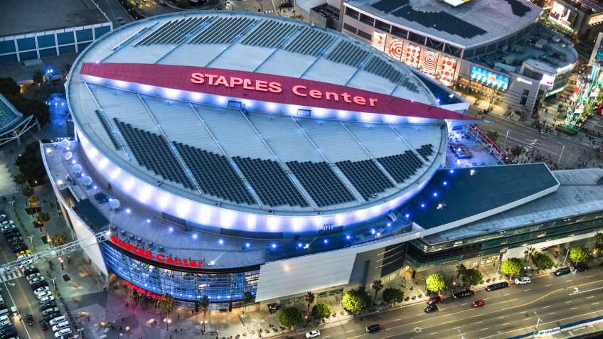 Los Angeles, California, USA - March 23, 2016: Aerial view of the Staples Center Arena and the Los Angeles skyline at dusk, the image has been taken from an helicopter.