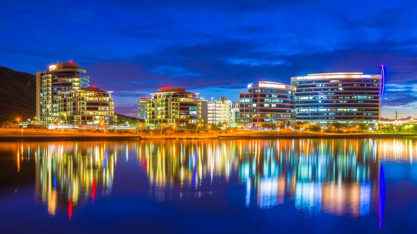 Tempe, Arizona downtown skyline at dusk with a beautiful sunset and reflections on Tempe Town Lake.