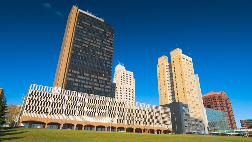"Toledo, Ohio downtown highrise buildings with a park in the foreground.