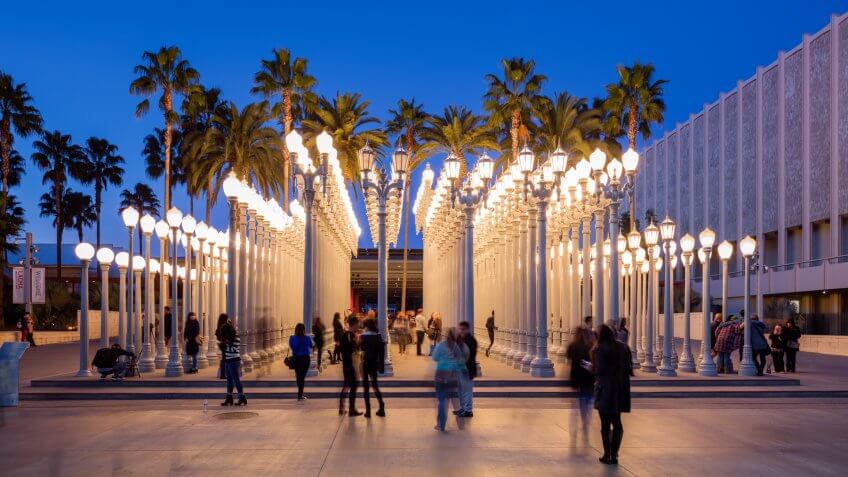 Los Angeles, California, USA - July 7th, 2016: Visitors at one of LA's landmark the "Urban Light" by Chris Burden which is a well-known installation in at LACMA.
