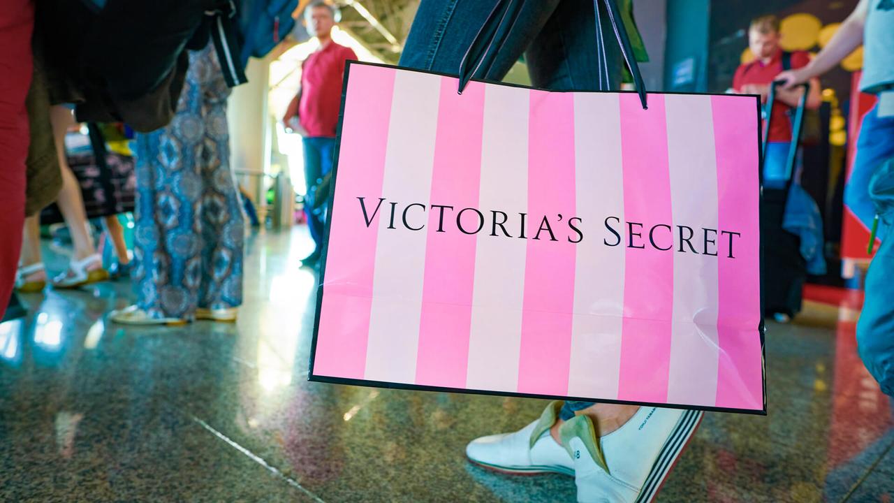 MOSCOW, RUSSIA - CIRCA AUGUST, 2018: a woman stand with Victoria's secret branded shopping bag in Vnukovo International Airport.