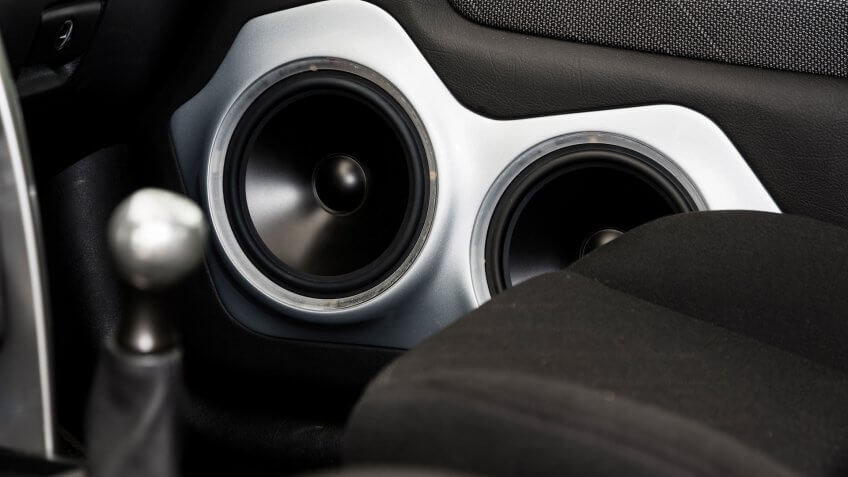A close up image of a car door speakers.