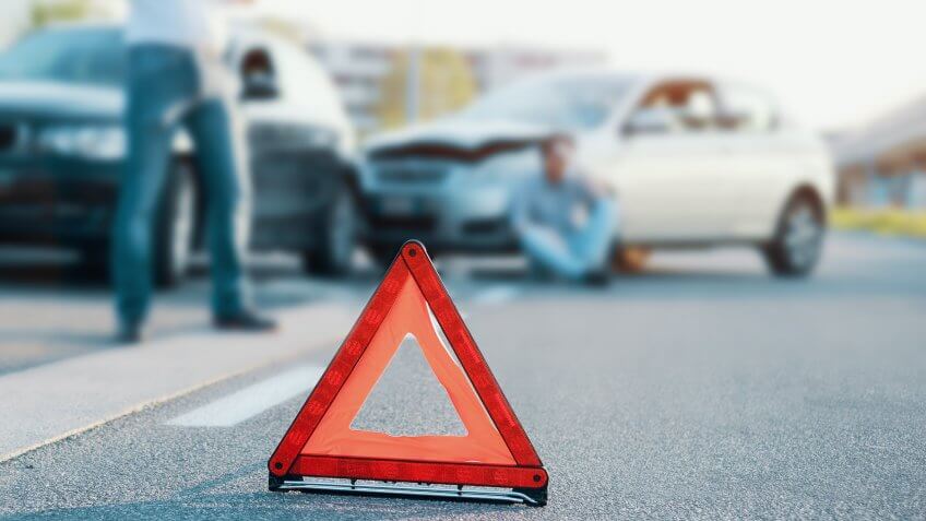 car wreck with emergency cone