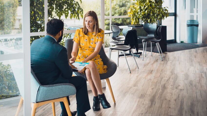 female colleague talking with businessman