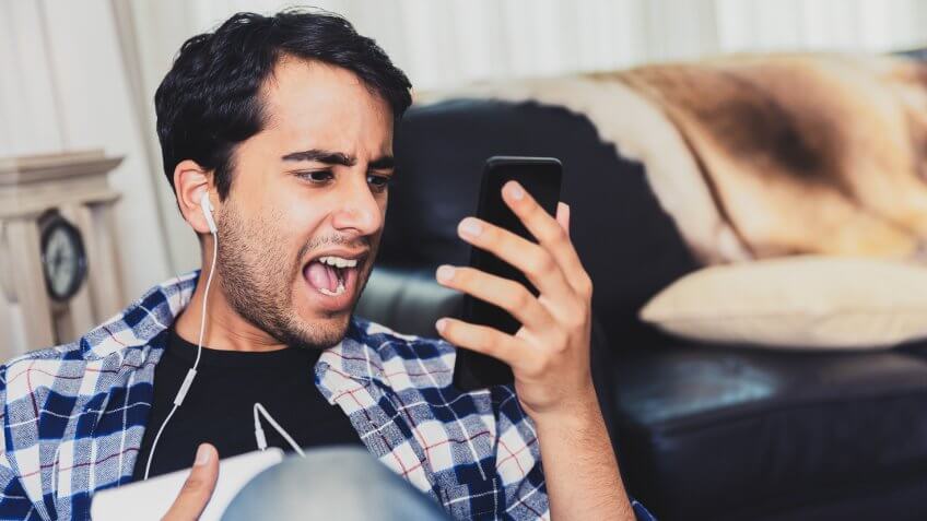 frustrated guy talking to sales phone call.