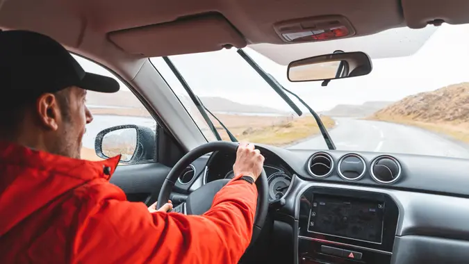 guy driving a car