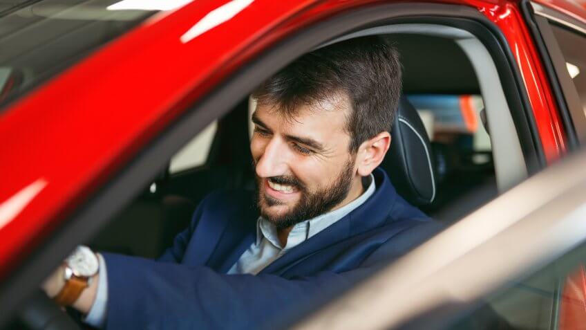Young man in a car.