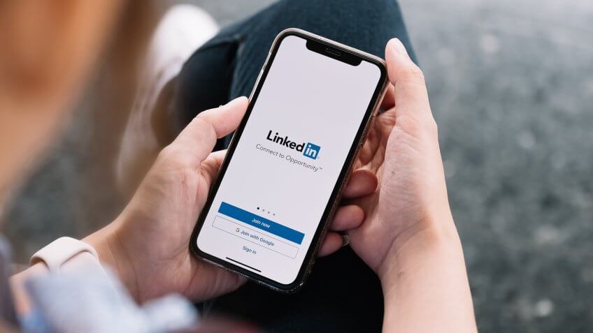 man signing into LinkedIn on mobile app