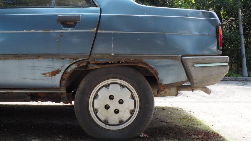 old car with rust on body.