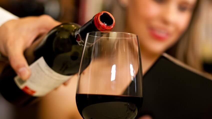 waiter pouring wine