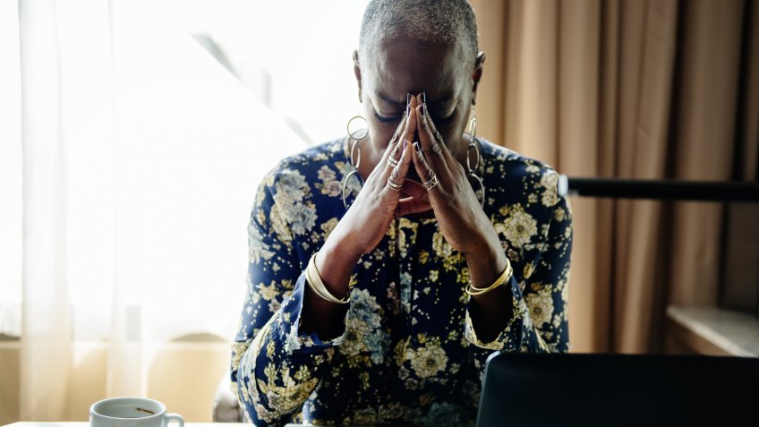 Woman stressed alone in the room.