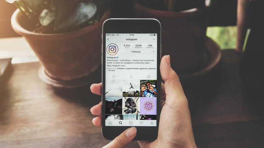 woman using Instagram on smartphone